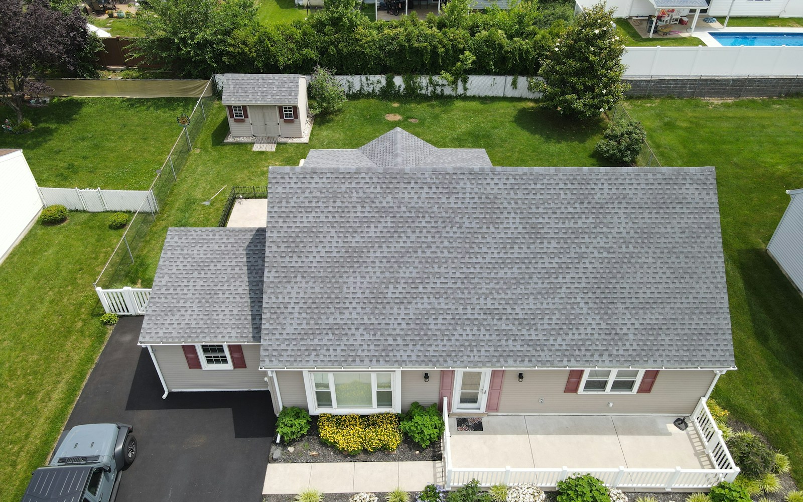Aerial view of a home with an architectural asphalt shingle roof